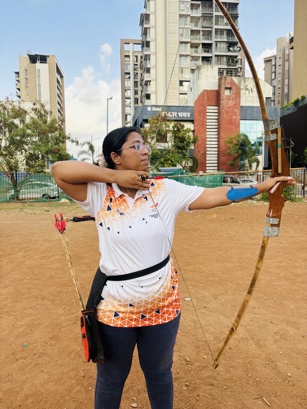 Archer aiming a bow and arrow during training