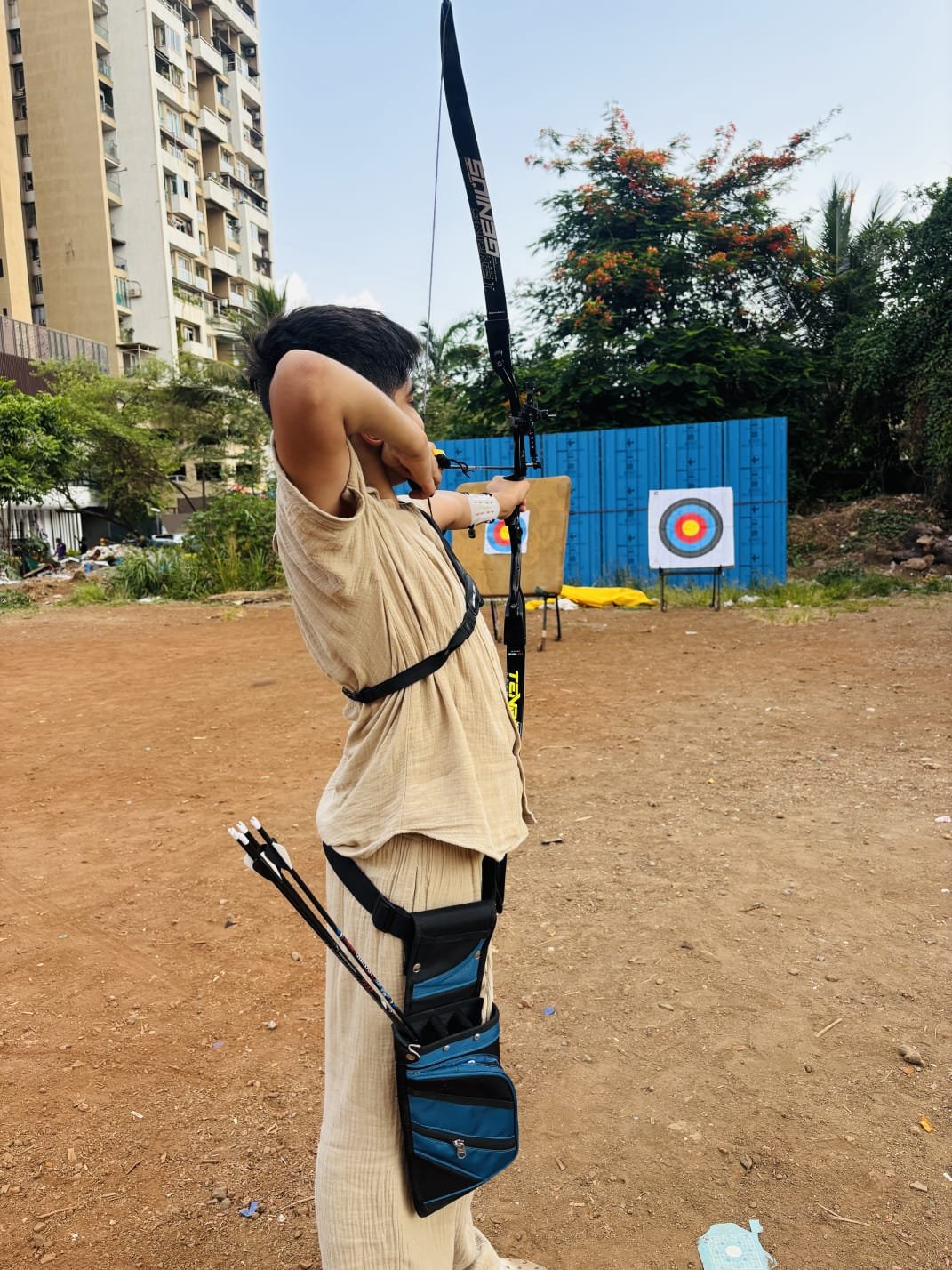 Student carrying a quiver of arrows